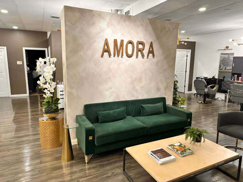 AMORA salon interior with signature wall