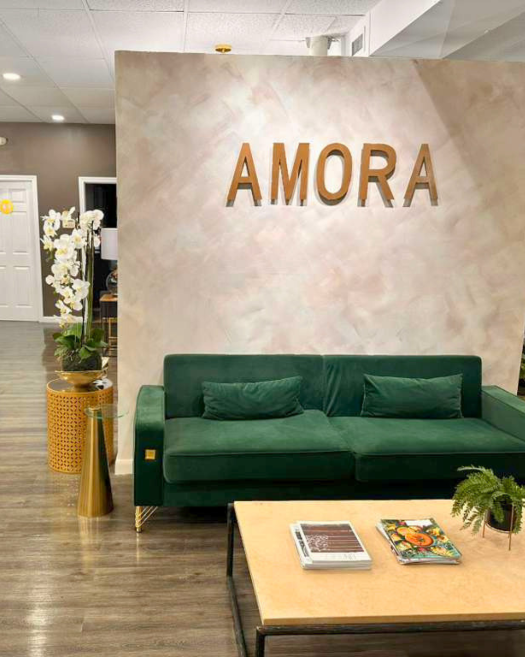 AMORA signature wall with velvet lounge